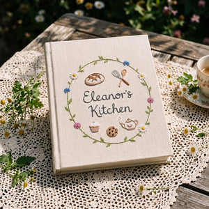 Personalized cottage kitchen hand embroidered recipe book featuring floral wreaths baking tools teapot bread cupcake and botanical embroidery