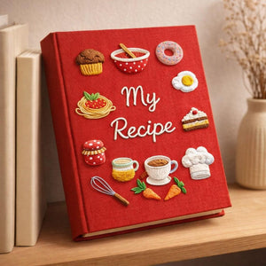 Personalized hand embroidered recipe book featuring muffins, donuts, cakes, coffee cups, jam jars, chef hat, whisk and bakery themed illustrations on linen cover.