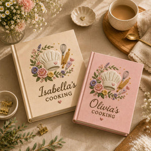 Personalized baker's garden hand embroidered recipe book featuring chef hat whisk rolling pin piping bag and floral embroidery on linen cover