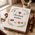 Hand embroidered recipe book featuring strawberries cookies cupcake teapot teacup whisk and floral wreath with personalized kitchen text.