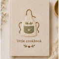 Hand embroidered recipe book featuring a minimalist cottagecore apron design on a linen hardcover notebook.