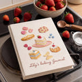 Hand embroidered baking journal featuring strawberry cake macarons pastries berries and dessert motifs on linen cover