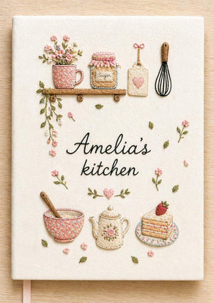 Personalized hand embroidered recipe book featuring floral teapot whisk sugar jar mixing bowl strawberry cake and cottage tea party motifs