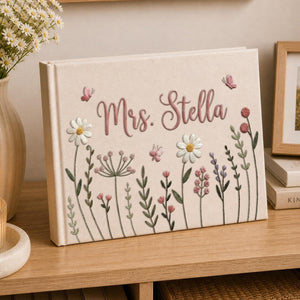 Personalized cottage garden floral hand embroidered linen notebook with daisies wildflowers and custom name