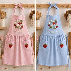 Personalized hand embroidered strawberry garden linen apron featuring strawberries, white flowers, botanical vines and custom text, cottagecore kitchen apron gift.