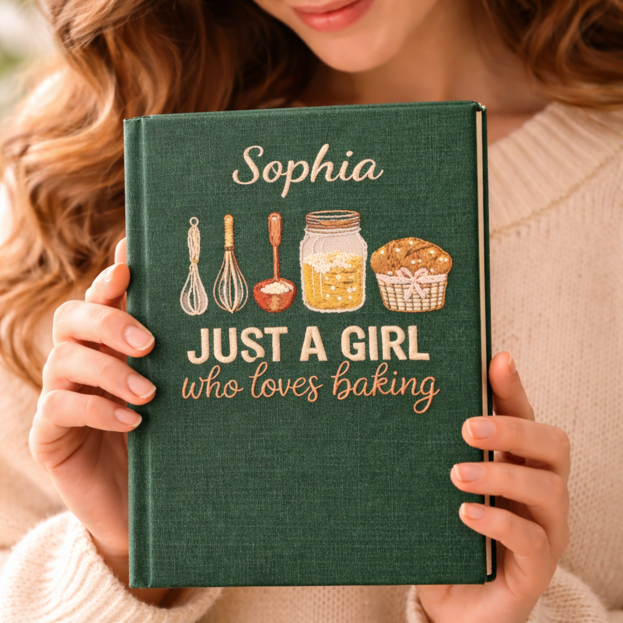 Personalized hand embroidered recipe book featuring baking tools, pantry ingredients, whisk illustrations, and rustic farmhouse baking-themed embroidery on a linen cover.